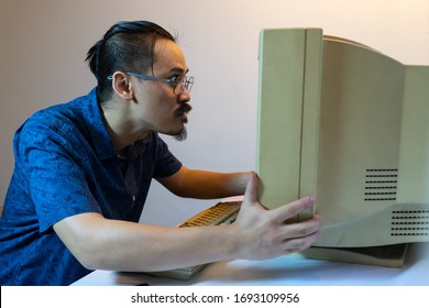 Old Personal Computer With Man Very Stressed . Ancient Concept