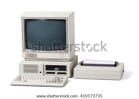 Old personal computer. The system unit, floppy drive, monitor, printer and keyboard isolated on white background.