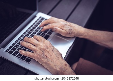 Old Persons Hands On Computer Keyboard