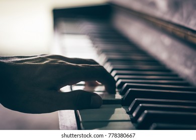 Old Person's Hands Playing The Piano.