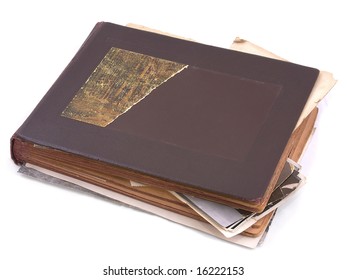 Old photo album with photos isolated on white.