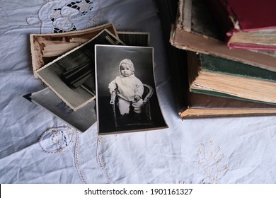 Old Photo Albums Lie On A White Mint Tablecloth, Vintage Photographs Of 1960, Concept Of Family Tree, Genealogy, Childhood Memories, Connection With Ancestors
