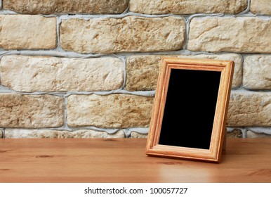 Old Photo Frame On The Wooden Table