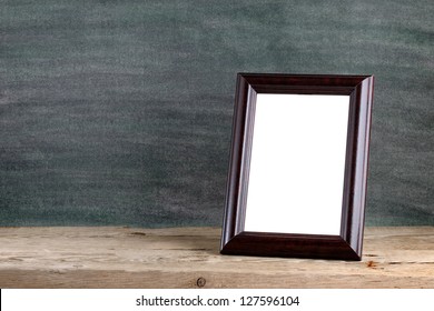 Old Photo Frame On Wooden Table