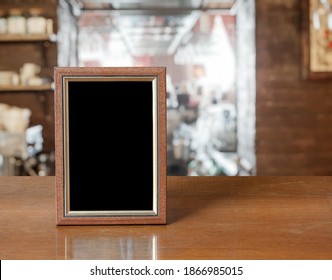 Old Photo Frame On The Wooden Table In A Night Club