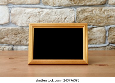 Old Photo Frame On The Wooden Table