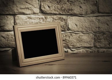 Old Photo Frame On The Wooden Table