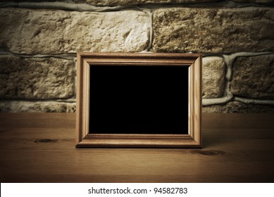 Old Photo Frame On The Wooden Table