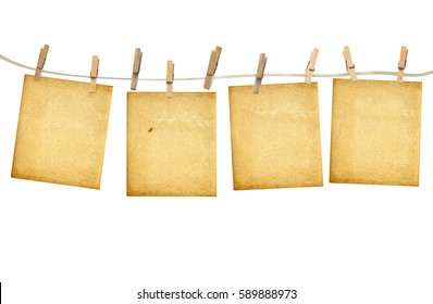 Old photoframes are hanging in the row  isolated on white background