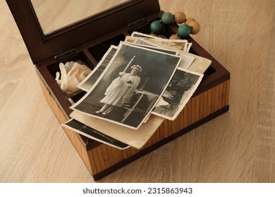 old photographs 1930, dear to heart memorabilia in vintage wooden box, stack of retro photos, vintage photographs, concept family tree, genealogy, memories, home archive, keep as keepsake