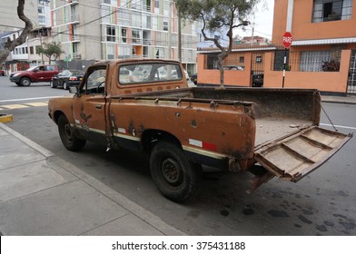 Old Pickup With Open Tailgate Parked In The Streets.