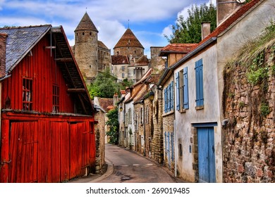 Old picturesque lane with medieval towers in the village of Semur en Auxois, Burgundy, France        