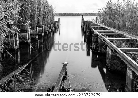 Similar – Brücke im Nebel See Steg