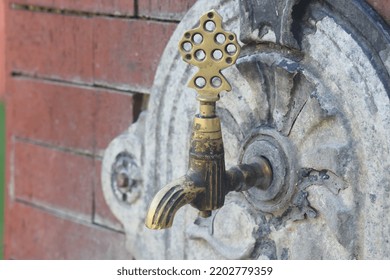 Old Pipe Faucet Attached To A Wall. Pipe Knob