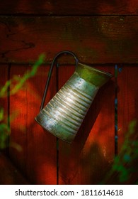 Old Pitcher On Red Barnwood Door Verical