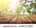 Old plank wooden board with an abstract beautiful blurred background.