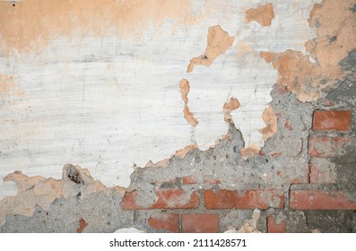 Old plaster cracked on the wall