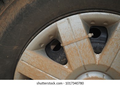 Old Plastic Rim On Car Wheel With Dirty Stain