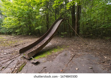 Old Playground In Abandoned Ghost Town Pripyat, Post Apocalyptic City, Summer Season In Chernobyl Exclusion Zone, Ukraine