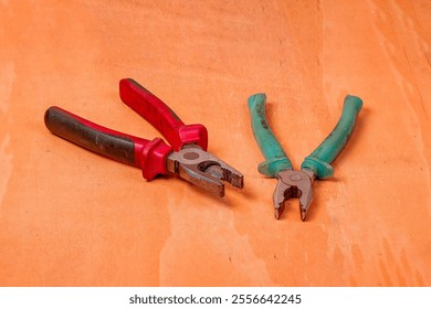 Old pliers on a wooden surface close-up - Powered by Shutterstock