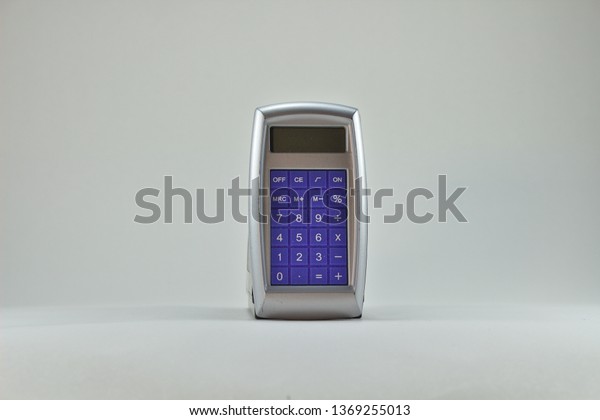 old pocket\
calculator blue front with silver\
back