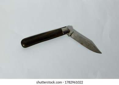 Old Pocket Knife Against A White Background