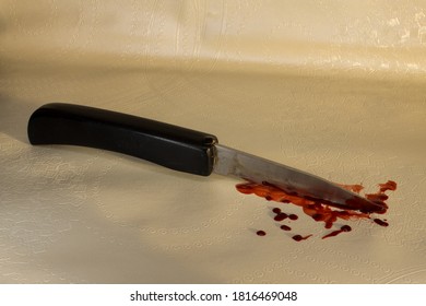 An Old Pocket Knife With Blood On The Blade