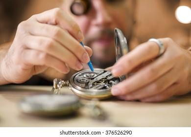 Old Pocket Watch Being Repaired By Watch Maker