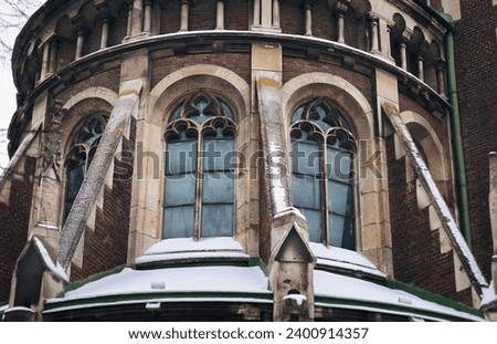 Old pointed gothic windows with stained glass on facade of the building. Baroque and Gothic architecture. Church of St. Olga and Elizabeth. Lviv, Ukraine. Stock photo © 
