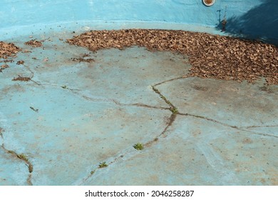 An Old Pool With No Water In It. Drought Concept Photo. 