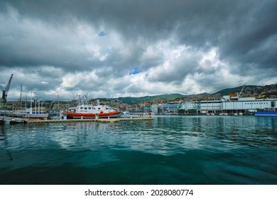 Old Port Porto Antico Of Genoa (Genova) With Yachts And Boats With Aquarium Biosphere Building Under Stormy Sky. Genoa, Italy