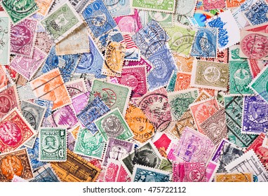 Old postage stamps from various countries as background - Shutterstock ID 475722112