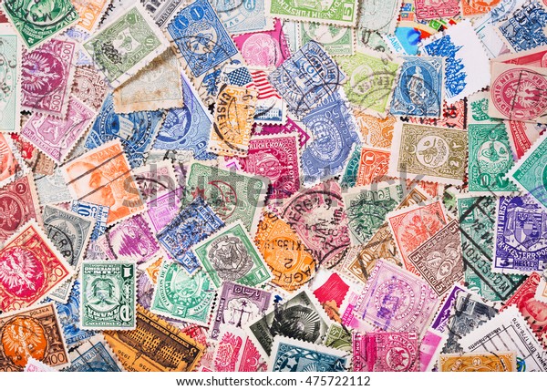 Old\
postage stamps from various countries as\
background