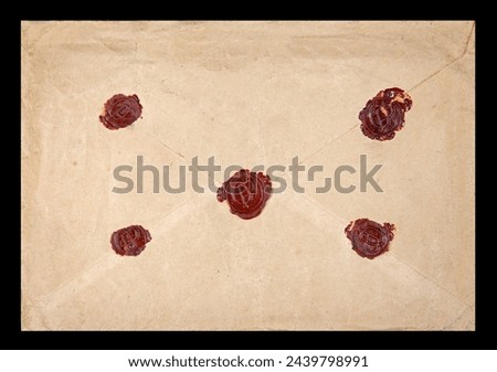 Old postal envelope with original wax seals on black background, message, air mail