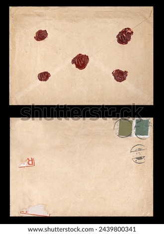 Old postal envelope with original wax seals on black background, message, air mail