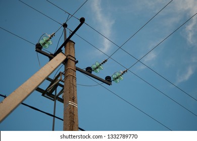 Old Power Line Support on the blue sky background.