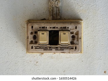  Old Power Switch For Lamp, Old Light Switch Without Cover On The White Cement Wall.