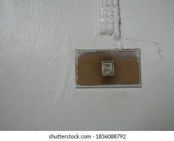 Old Power Switch On The White Wall,copy Space.