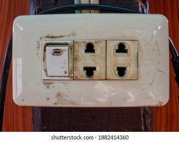 Old Power Switch And Power Plug On Wood.