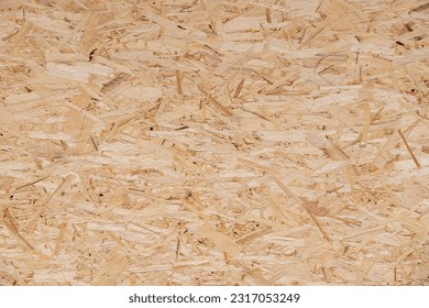 Old pressed chipboard a background. - Shutterstock ID 2317053249