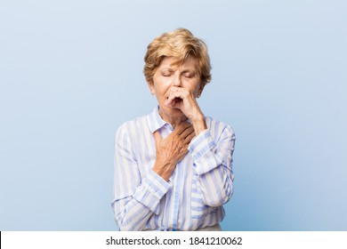 Old Pretty Woman Feeling Ill With A Sore Throat And Flu Symptoms, Coughing With Mouth Covered