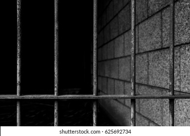old prison bars cell lock background dark black and light