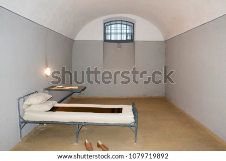 Old prison cell, bed and table