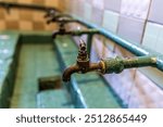 Old prison water taps at Karosta Military Prison Museum at the former Russian Imperial and Soviet Naval Base.