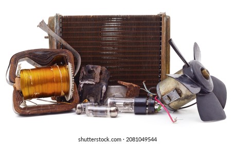 Old Propeller With Pile Of Scrap Metal And Radiator Isolated On A White Background.