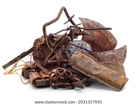 Old propeller with pile of scrap metal isolated on a white background.