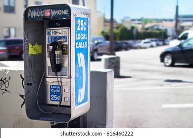 Old Public Pay Phone Next To A Parking Lot