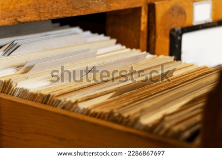 An old pull-out file cabinet with cards. Library, retro, shuffleboard  Сток-фото © 