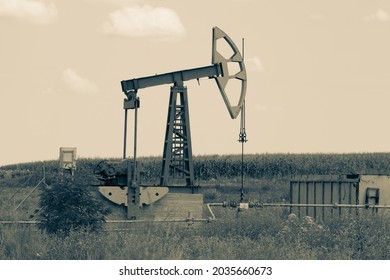 Old Pump Jack At Field. Petroleum And Gas Industry