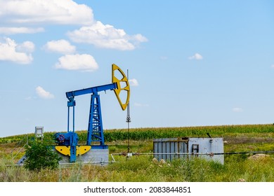 Old Pump Jack At Field. Petroleum And Gas Industry